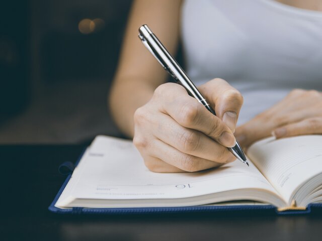 Girl Writing in Journal